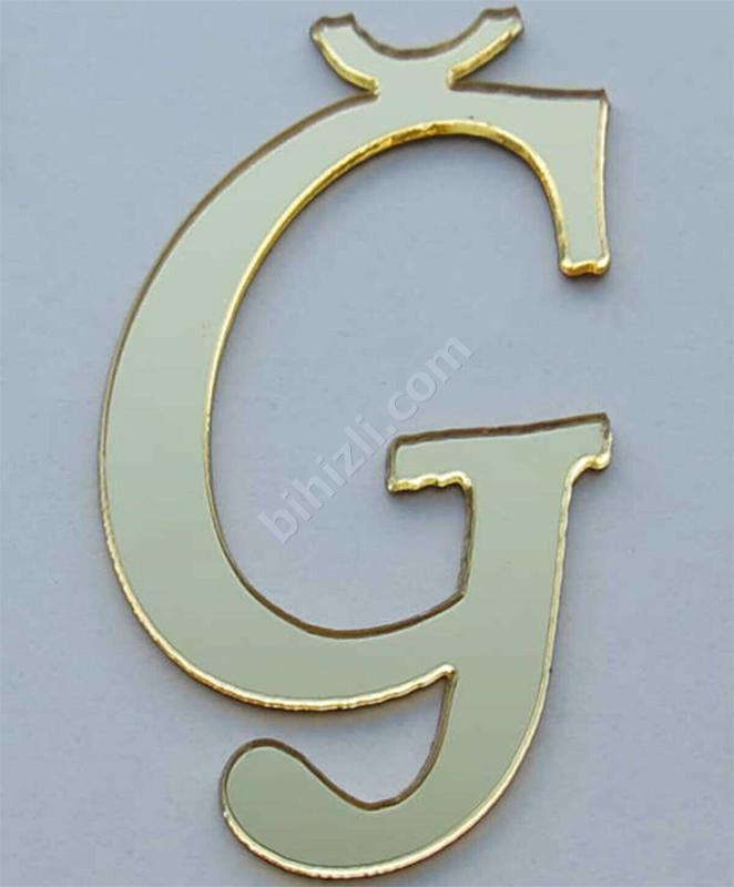 G harfi (altın renk)